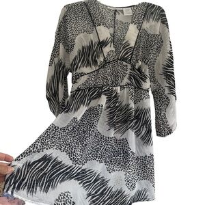 Lavender Star size large black and white super sheer‎ flare sleeve tunic blouse.